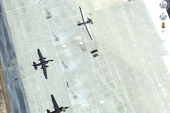 A Global Hawk drone and two U2 manned spy planes on the tarmac at Beale Air Force Base in California.